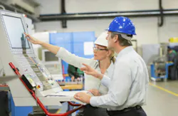 Engineers Working On Industrial Control System