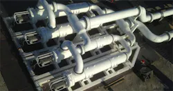 QS Energy’s AOT is a patent-protected hardware system designed to reduce the viscosity of crude oil transported via pipeline through the principles of electrorheology. (Photo courtesy of QS Energy)