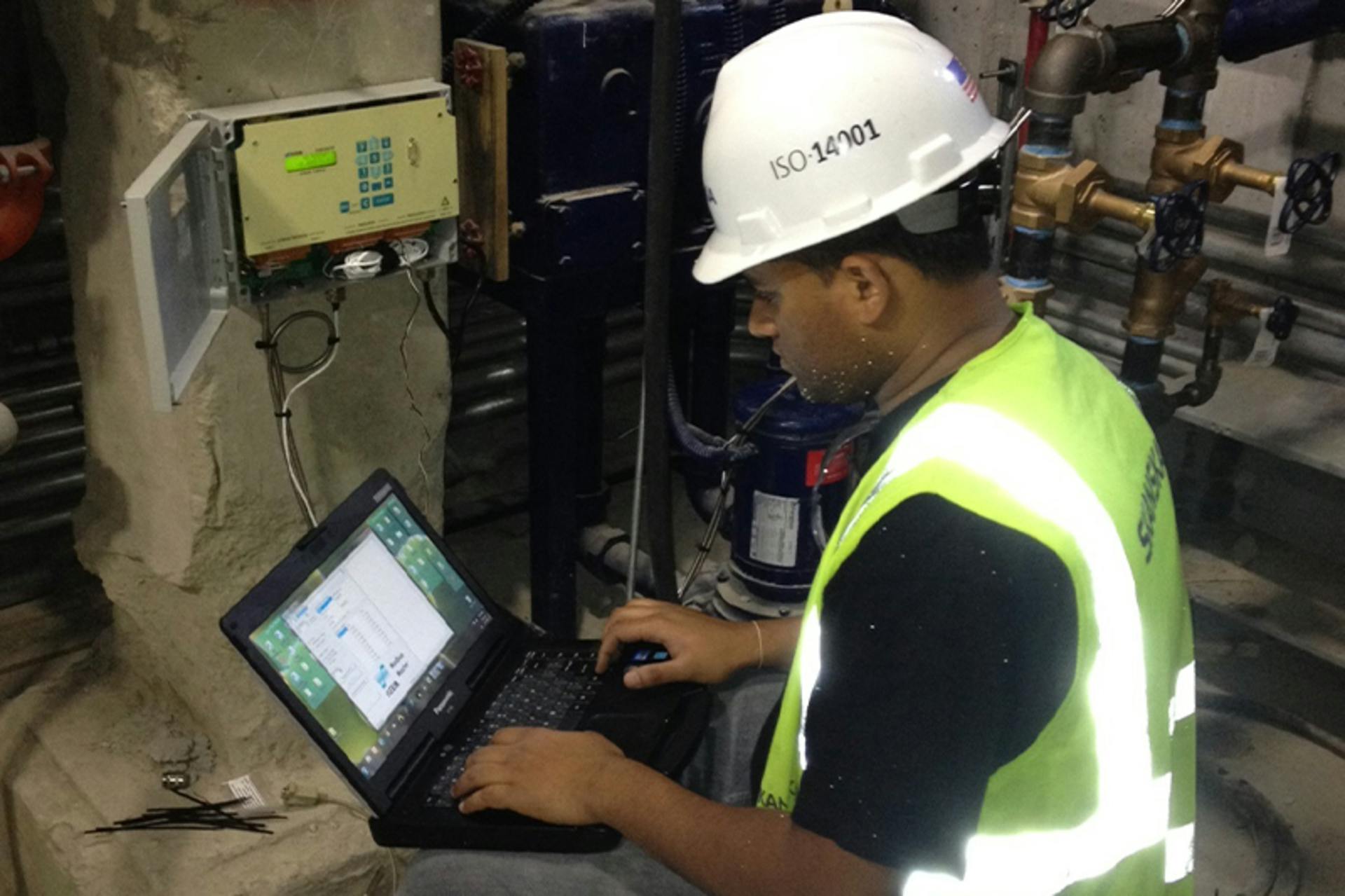A technician monitors condensate flow at a university&rsquo;s steam boiler heating system. All images courtesy of FLEXIM