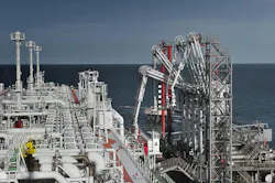 Natural gas loading onto an LNG tanker. teekid/iStock.