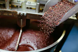 Cocoa grits are added into the chocolate-making process. primipil/iStock Cocoa grits are added into the chocolate-making process. primipil/iStock