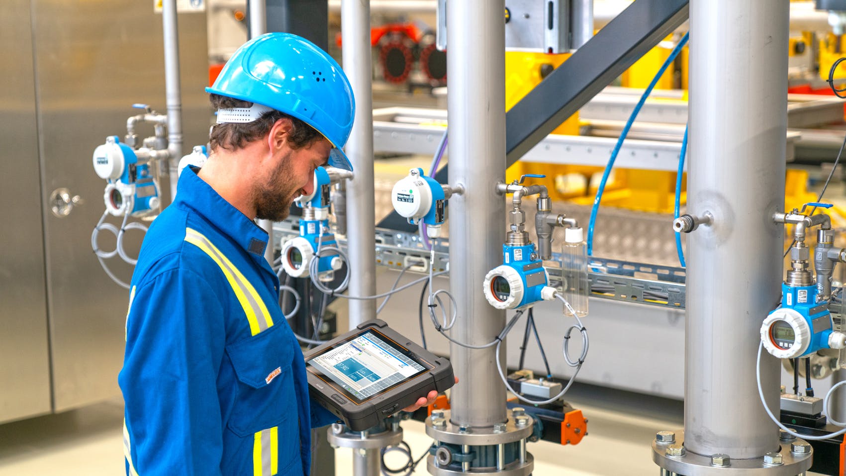 Figure 1. With Bluetooth, a technician can access a temperature instrument from up to 40 feet away using an Endress+Hauser Field Xpert SMT70 handheld tablet PC tool.