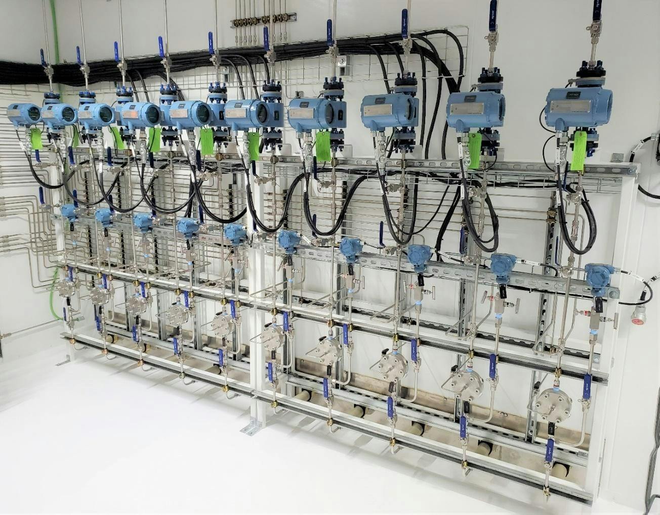 Figure 1. In this water injection skid with multiple flow control systems for dosing freshwater at the base of oil wells in the Bakken Basin of North Dakota, the lower row of components are stainless steel direct-sealing diaphragm valves.