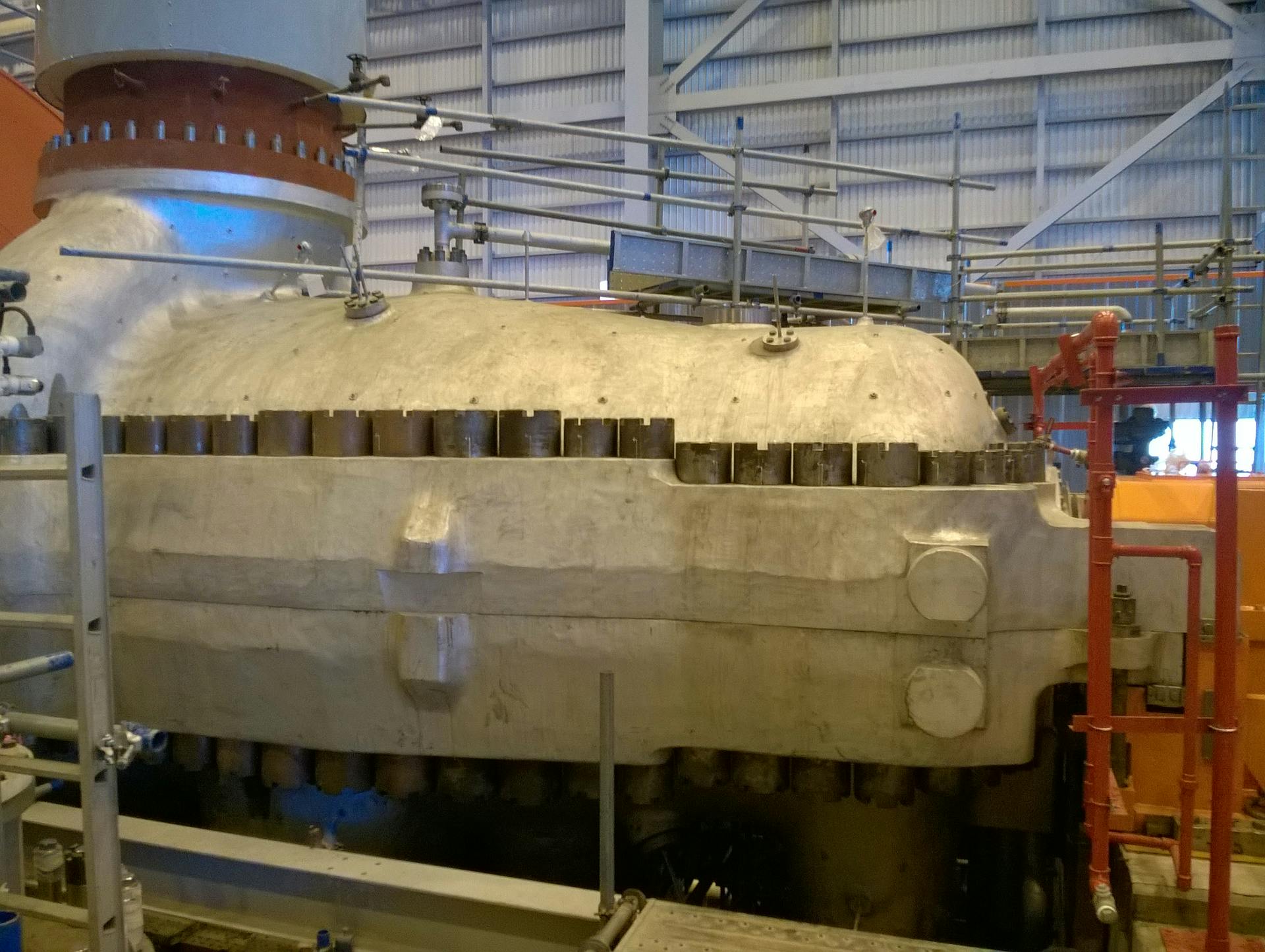 Figure 1. An example of a large high-pressure, high-flow machinery during installation. Such machinery needs sophisticated control and condition monitoring systems with many sensors.