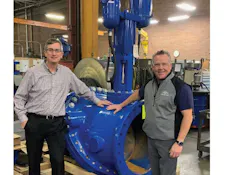 John Ballun and Rob McDonald standing next to a 30' Tilted Disc Check Valve at Val-Matic’s Elmhurst facility. John Ballun and Rob McDonald standing next to a 30' Tilted Disc Check Valve at Val-Matic’s Elmhurst facility.