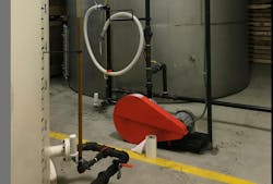 Two 20-foot tanks located inside the tortilla products processing facility hold supplies of virgin and wasted cooking oil. Two 20-foot tanks located inside the tortilla products processing facility hold supplies of virgin and wasted cooking oil.