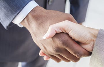 African American Businessman &amp; Woman Shaking Hands