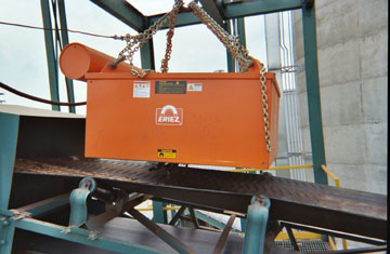 Eriez&Acirc;&circledR; Model SE-7535 Manual Clean Suspended Electromagnet suspended over a conveyor belt.