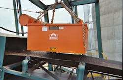 Eriez® Model SE-7535 Manual Clean Suspended Electromagnet suspended over a conveyor belt. Eriez® Model SE-7535 Manual Clean Suspended Electromagnet suspended over a conveyor belt.