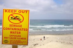 sewage sign at beach sewage sign at beach