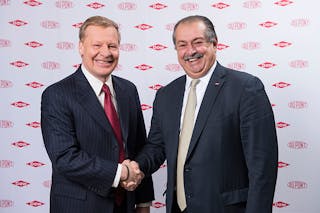 Edward D. Breen, chairman and chief executive officer of DuPont, shakes hands with Dow Chairman and CEO Andrew N. Liveris. Courtesy of DuPont.