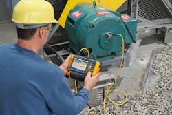 A technician uses a vibration tester on an operational motor. All images courtesy of Fluke Corporation