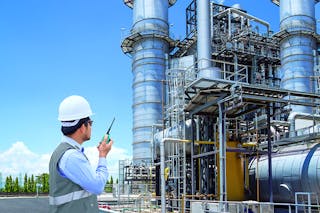 Engineer working at thermal power plant with talking on the walkie-talkie for controlling work; Shutterstock ID 561669874; Bestellnummer: &ndash;