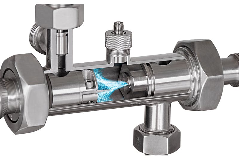 This inline homogenizing device, known as a Sonolator, uses a sharp blade in the fluid path to create additional cavitation. All images courtesy of Sonic Corp.