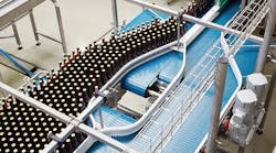 NORD 93.1 helical bevel gear units with NSD TUPH powering a washdown bottling conveyor.