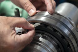 This technician is using a feeler gauge to measure the radial internal clearance (RIC) of a bearing. This technician is using a feeler gauge to measure the radial internal clearance (RIC) of a bearing.