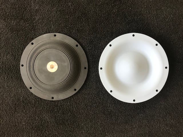 Front and back view of a single piece PTFE diaphragm (diaphragm &amp; plate).