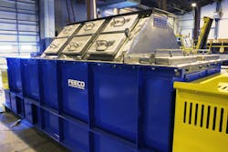 Pugmill mixer with raised cover assembly including inspection/access doors. The raised stainless-steel cover served as a fume hood, as the mixer was carrying out a reaction. Pugmill mixer with raised cover assembly including inspection/access doors. The raised stainless-steel cover served as a fume hood, as the mixer was carrying out a reaction.