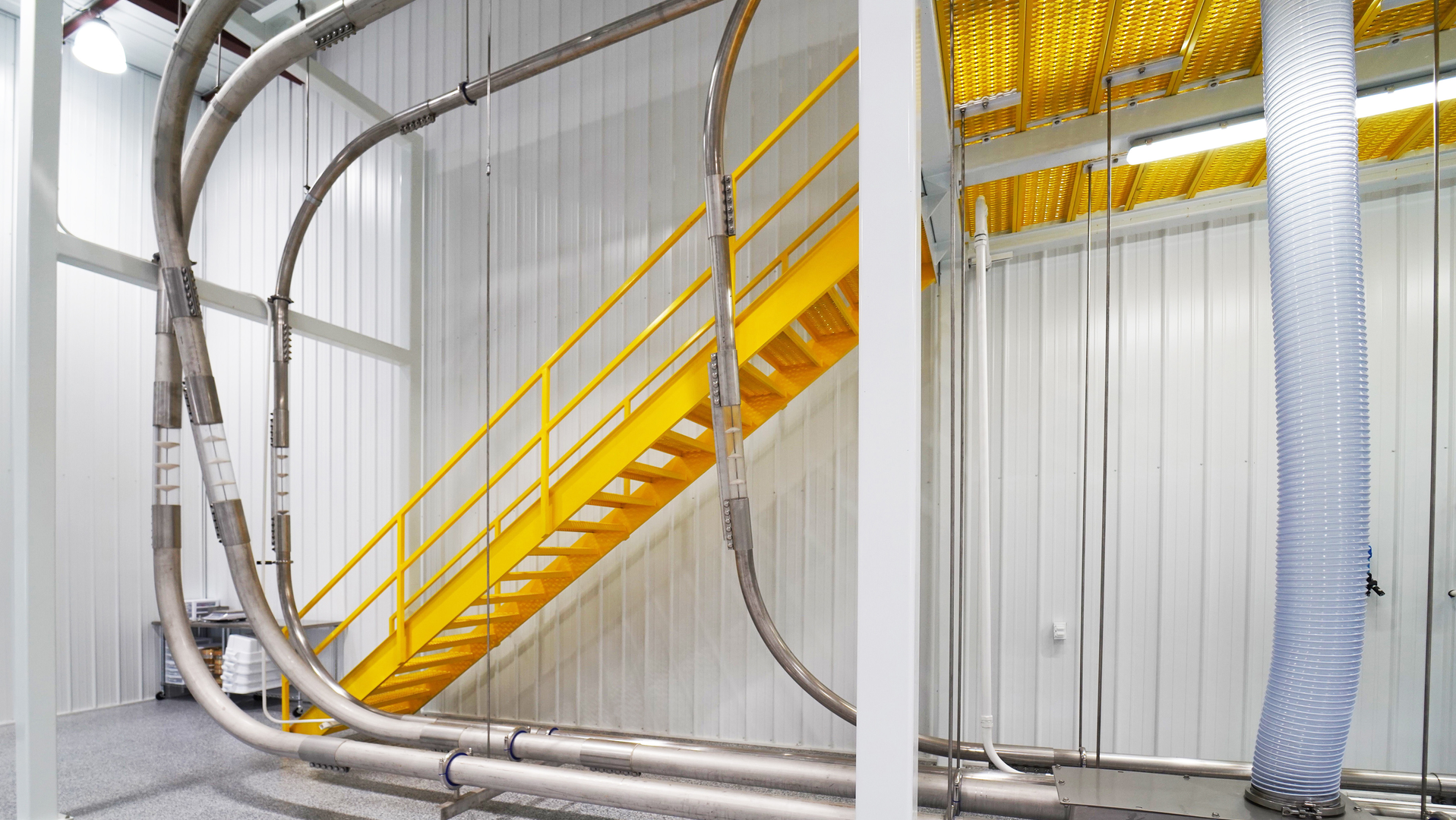 Tubular drag systems eliminate potential ignition sources, convey material with less force and otherwise reduce the risk of dust explosion.