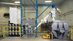 The BFC model bulk bag discharger, equipped with cantilevered I-beam, hoist and trolley, lifts the bulk bag from the level below. The bulk bag discharger and flexible screw conveyor gently feed the blender which mixes protein powder and other ingredients. The BFC model bulk bag discharger, equipped with cantilevered I-beam, hoist and trolley, lifts the bulk bag from the level below. The bulk bag discharger and flexible screw conveyor gently feed the blender which mixes protein powder and other ingredients.