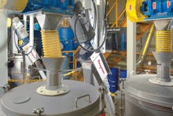 Each pair of interconnected flexible screw conveyors discharges processed material into a separator for further processing. Each pair of interconnected flexible screw conveyors discharges processed material into a separator for further processing.