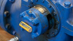 A Fluke 3561 FC Vibration Sensor attached to a motor housing where data will be collected. A Fluke 3561 FC Vibration Sensor attached to a motor housing where data will be collected.