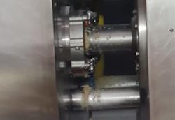 Figure 4: The contacting air seal (above) allowed product leakage and potential contamination. The new air seal (below) has prevented any leakage for nearly a year of operation. Figure 4: The contacting air seal (above) allowed product leakage and potential contamination. The new air seal (below) has prevented any leakage for nearly a year of operation.