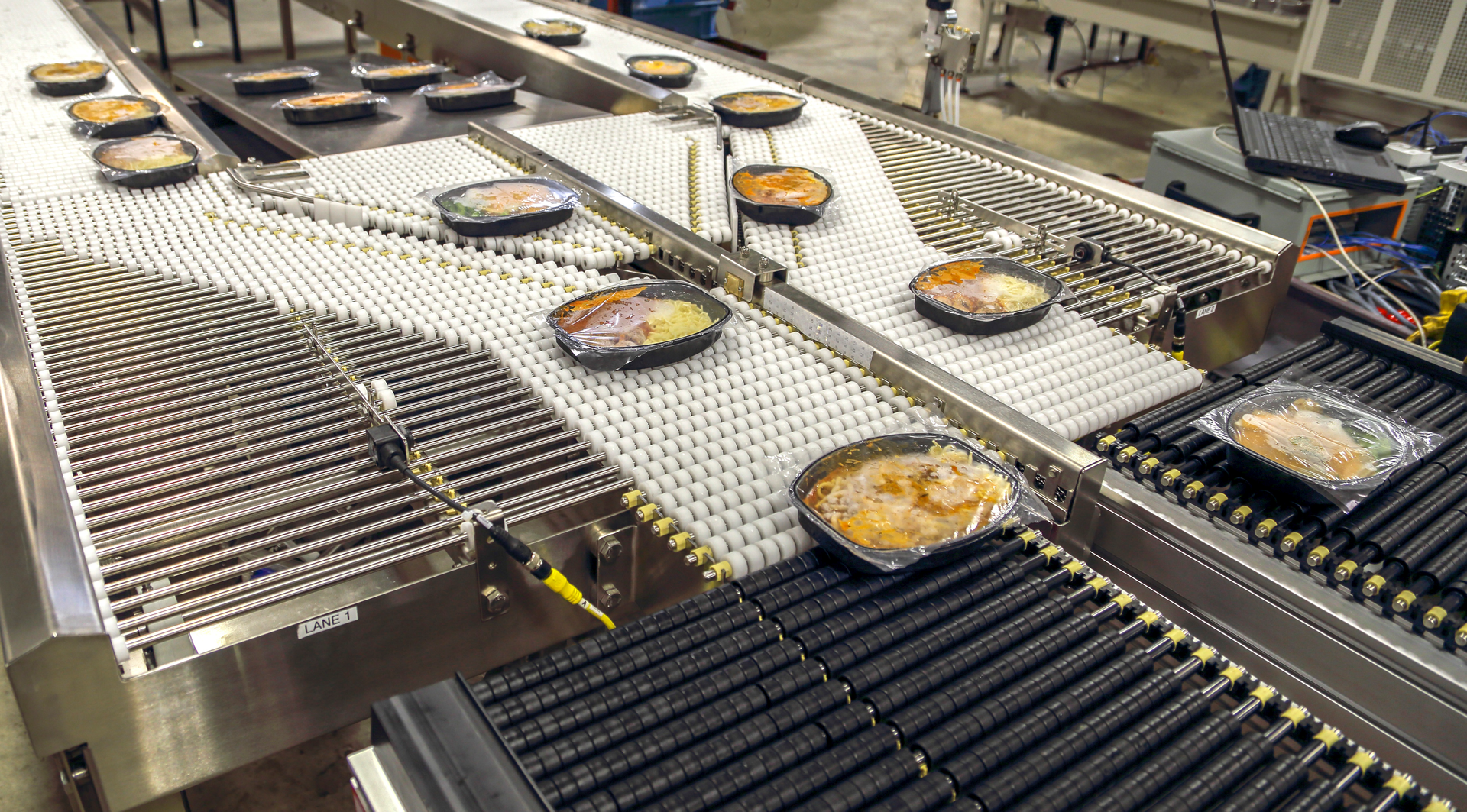 Conveying ready-to-eat meals through production processes.