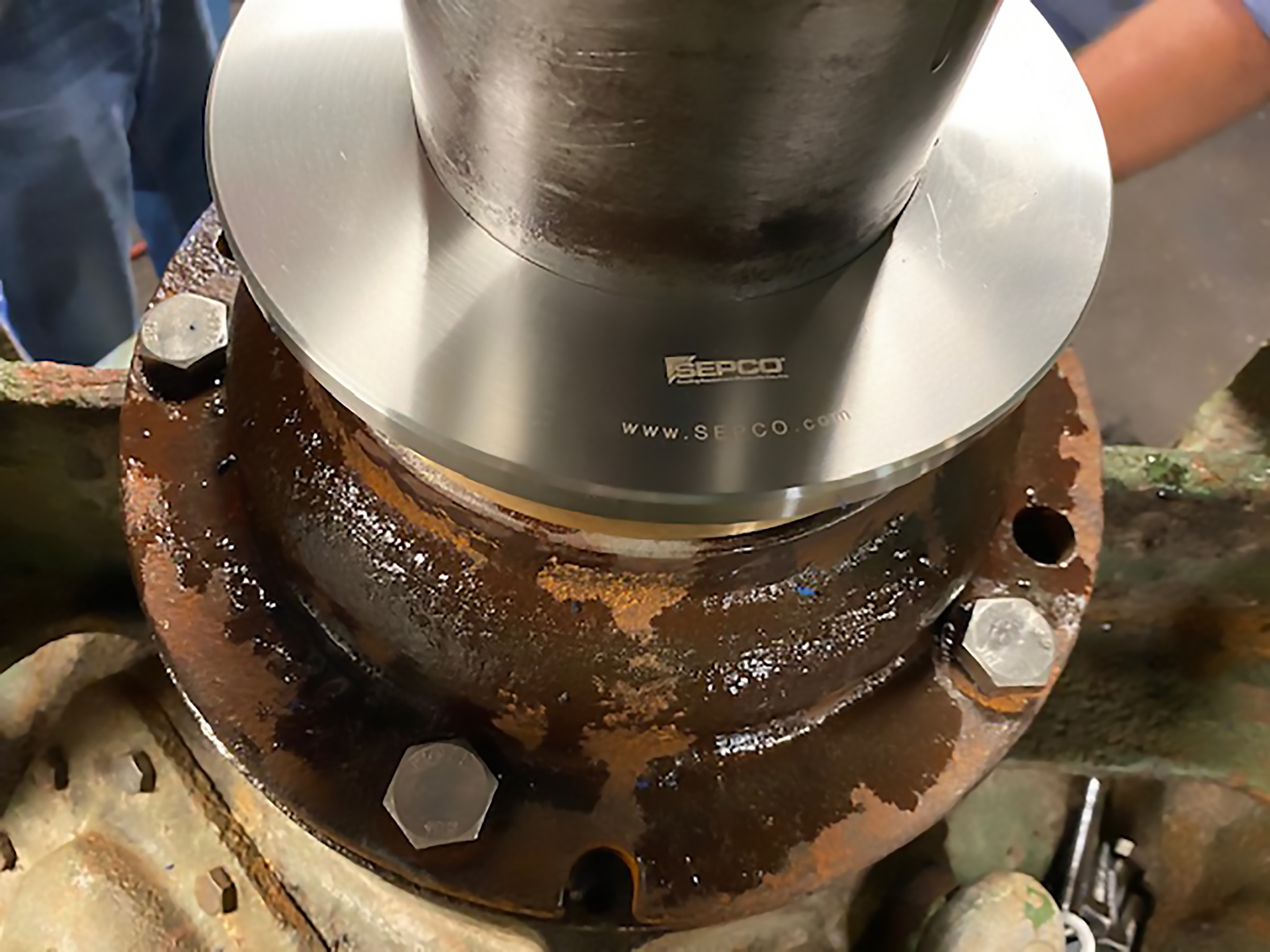 A noncontact, compound labyrinth bearing isolator installed on a hydrapulper in a paper mill.