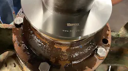 A noncontact, compound labyrinth bearing isolator installed on a hydrapulper in a paper mill.