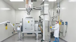 Drums containing each ingredient are lifted, aligned with the mixer's stationary inlet and emptied in a prescribed order according to the master batch record.