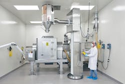 Drums containing each ingredient are lifted, aligned with the mixer's stationary inlet and emptied in a prescribed order according to the master batch record. Drums containing each ingredient are lifted, aligned with the mixer's stationary inlet and emptied in a prescribed order according to the master batch record.