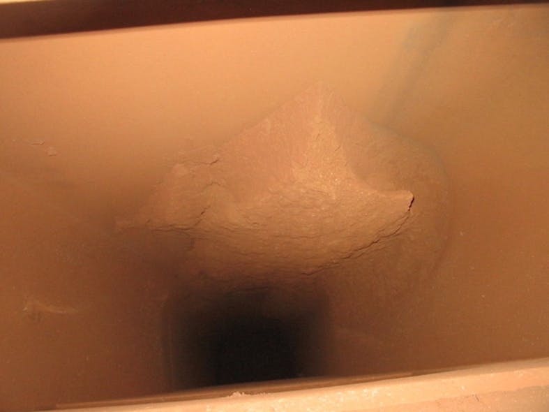 Figure 2: An example of sticky ore buildup in a feed chute to a rotary dryer.