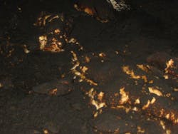 Photo 1: Self-heating of bulk solid materials begins with smoldering, which can set the material on fire and subsequently ignite airborne dusts. Photo 1: Self-heating of bulk solid materials begins with smoldering, which can set the material on fire and subsequently ignite airborne dusts.