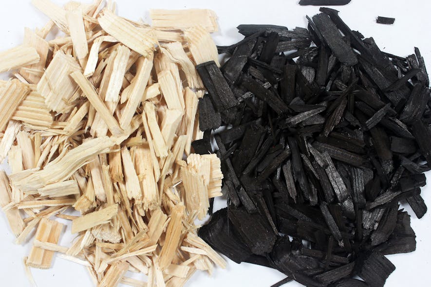 Wood chips converted to biochar in a rotary kiln.