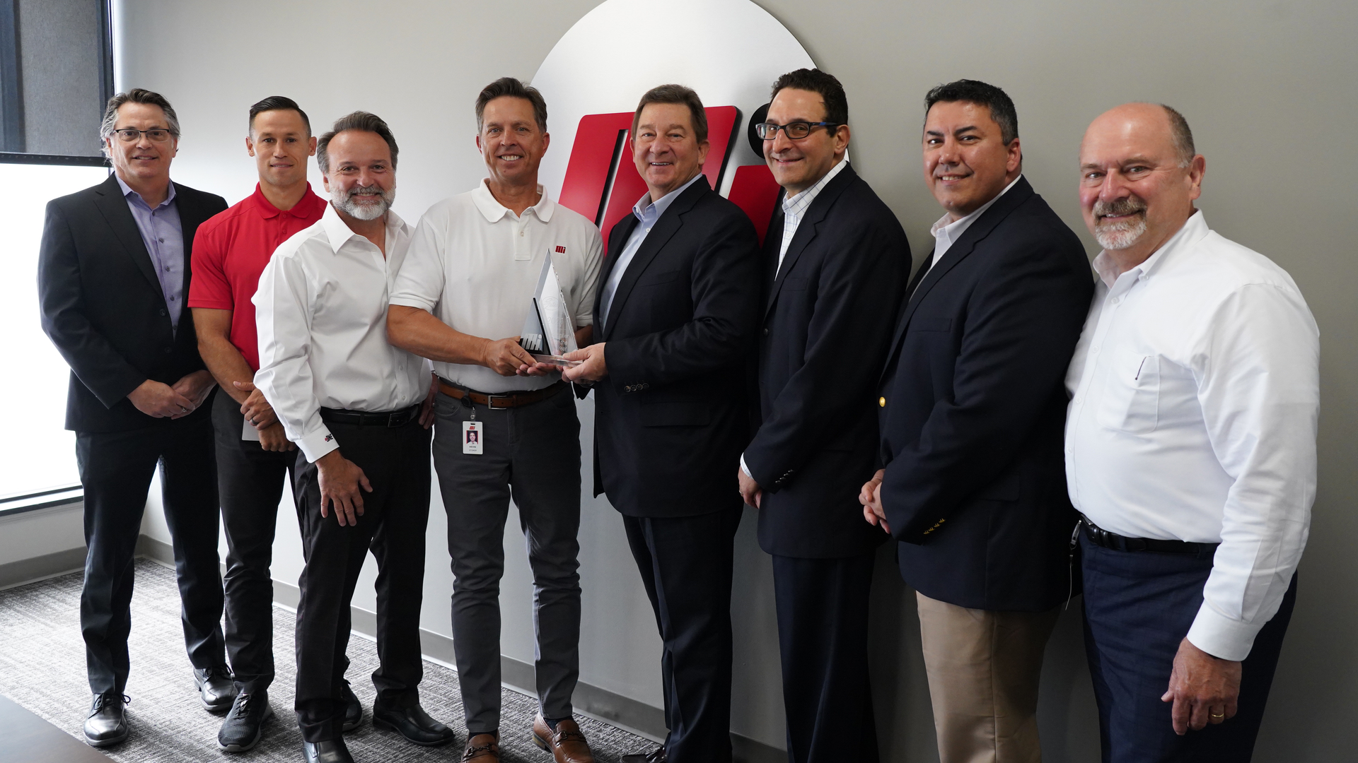 Motion and Gates officers at the award presentation, left to right: Scott Wright (Gates); Chris Brewer, Joe Limbaugh and Kevin Storer (Motion); Grant Gawronski, Lou Rosen and Mark Guner (Gates); and Robert Anaforian (Motion).