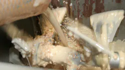 Milk, melted chocolate, chopped almonds and other ingredients are mixed in this Gericke continuous mixer. Each ingredient needs to be fed into the mixer at the predetermined temperature, moisture content and bulk density to ensure a consistently homogeneous mix.