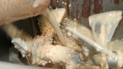 Milk, melted chocolate, chopped almonds and other ingredients are mixed in this Gericke continuous mixer. Each ingredient needs to be fed into the mixer at the predetermined temperature, moisture content and bulk density to ensure a consistently homogeneous mix. Milk, melted chocolate, chopped almonds and other ingredients are mixed in this Gericke continuous mixer. Each ingredient needs to be fed into the mixer at the predetermined temperature, moisture content and bulk density to ensure a consistently homogeneous mix.