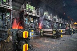 A hot strip mill within a steel factory. A hot strip mill within a steel factory.