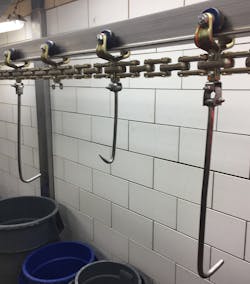 Made of stainless steel, the X248 with 2-inch pitch is one of the newer chains that replaces outdated cable conveyors. This example is on a head/tongue chain, shown in a beef plant application and is now virtually maintenance-free after replacing a high-maintenance cable conveyor. Made of stainless steel, the X248 with 2-inch pitch is one of the newer chains that replaces outdated cable conveyors. This example is on a head/tongue chain, shown in a beef plant application and is now virtually maintenance-free after replacing a high-maintenance cable conveyor.