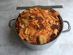 When measuring the loose bulk density of mixtures that contain large pieces or particles with extreme aspect ratios, such as the snack mix shown here, mechanical interlocking of particles will impact measurement results much more than surface friction or interparticle attraction. When measuring the loose bulk density of mixtures that contain large pieces or particles with extreme aspect ratios, such as the snack mix shown here, mechanical interlocking of particles will impact measurement results much more than surface friction or interparticle attraction.