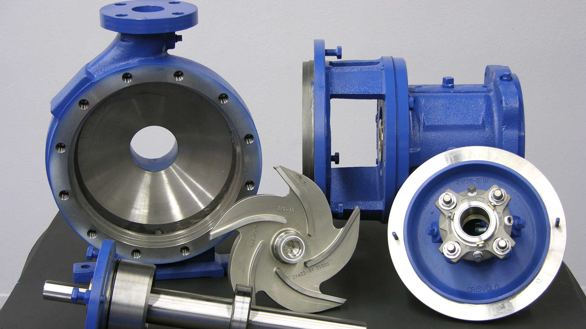 Major pump components laid out for inspection.