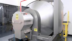 The mixer’s inlet and outlet (shown) remain stationary while the drum rotates, allowing hard connections to upstream mechanical or pneumatic conveyors and continuous mixing as material is discharged. The mixer’s inlet and outlet (shown) remain stationary while the drum rotates, allowing hard connections to upstream mechanical or pneumatic conveyors and continuous mixing as material is discharged.