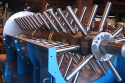 Interior view of pin mixer shaft with pins (with cover removed). Interior view of pin mixer shaft with pins (with cover removed).