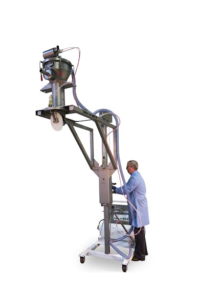 A mobile vacuum conveying system conveys material from the floor up and over processing or packaging equipment. The vacuum receiver is easily lowered to floor level for easy sanitation.