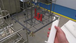 An AR model of a custom-designed wash rack in a pharmaceutical cleaning system appears next to its matching real-world wash rack to help workers set each item to be washed in its proper place for complete cleaning without error.