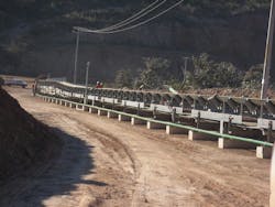 Concrete sleeper supports are visible on this overland conveyor. Concrete sleeper supports are visible on this overland conveyor.