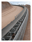 This overland belt conveyor is curved to follow the terrain.