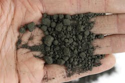 Ore dust after conditioning in a pugmill mixer. Ore dust after conditioning in a pugmill mixer.