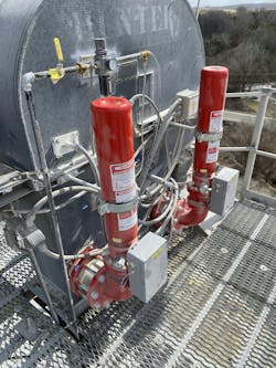 A bucket elevator’s head section is shown with chemical suppression system and hazard monitoring. A bucket elevator’s head section is shown with chemical suppression system and hazard monitoring.